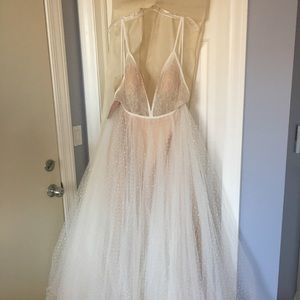 bride changing clothes for reception